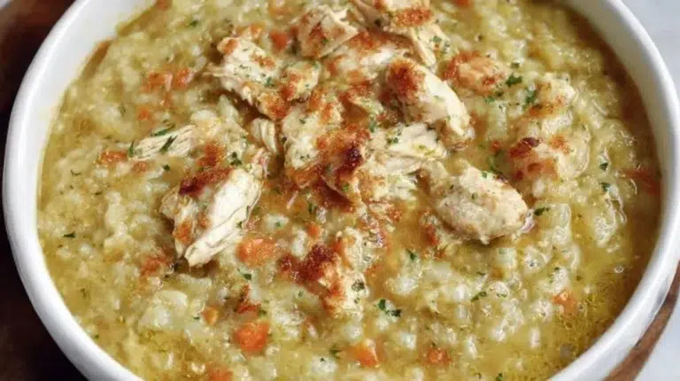 Bowl of 30-minute anti-inflammatory cauliflower chicken soup with herbs