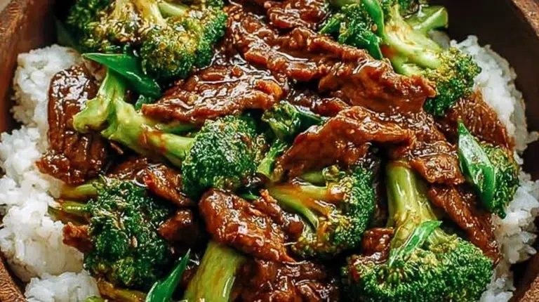 Chinese Beef and Broccoli served in a bowl with rice and vegetables