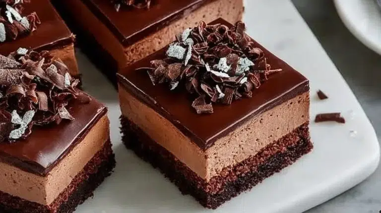Delicious Chocolate Mousse Brownies topped with chocolate shavings