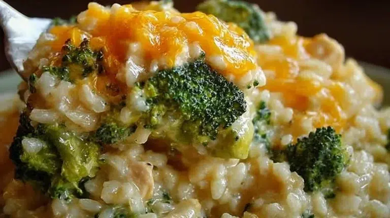 Delicious crockpot cheesy chicken with broccoli and rice served in a bowl.