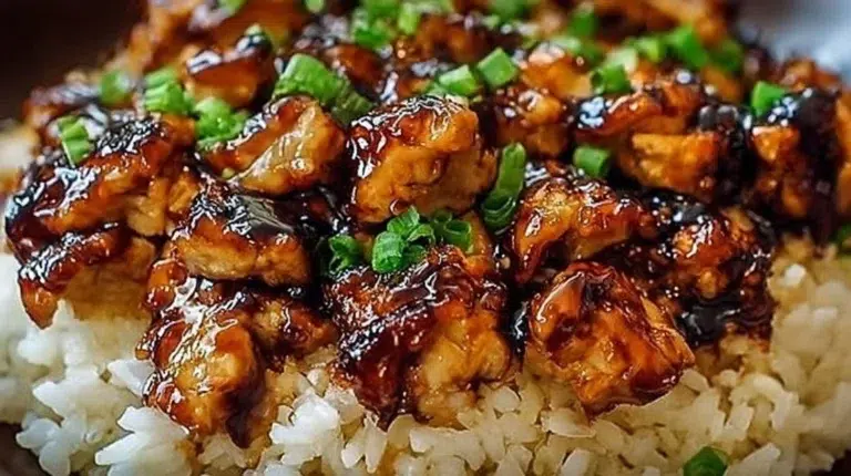 Delicious Honey BBQ Chicken served over rice, garnished with herbs.