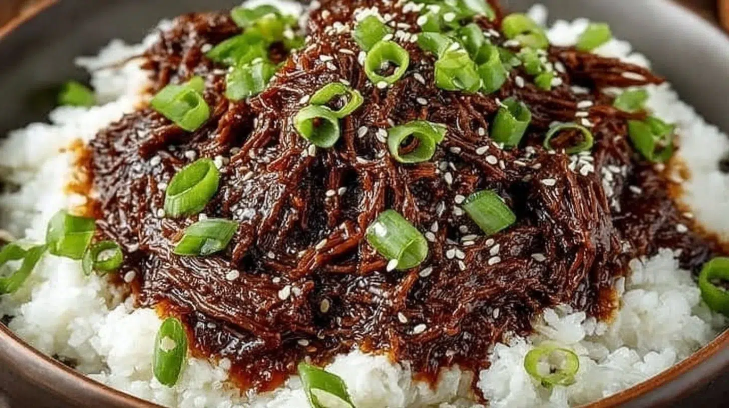 Delicious Slow Cooker Korean Beef garnished with green onions