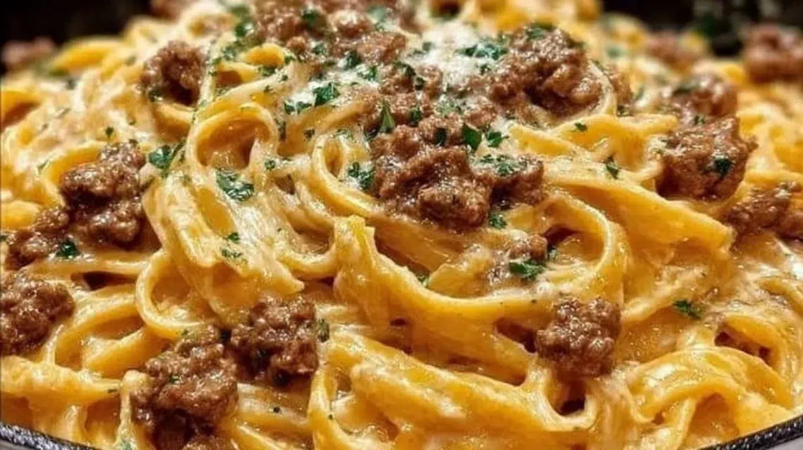Creamy garlic butter pasta with ground beef in a bowl