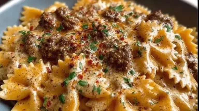 Creamy garlic parmesan beef bowtie pasta dish served in a bowl
