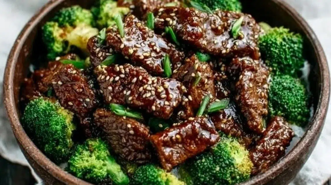 Crockpot Beef and Broccoli in a bowl with rice