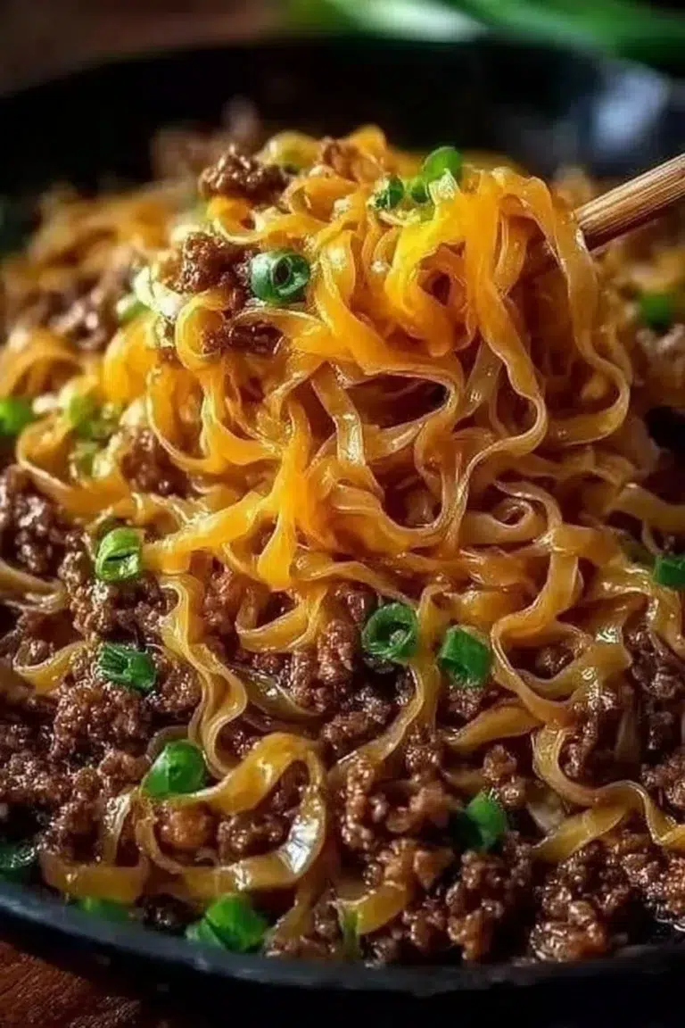 Plate of Mongolian Ground Beef Noodles garnished with green onions
