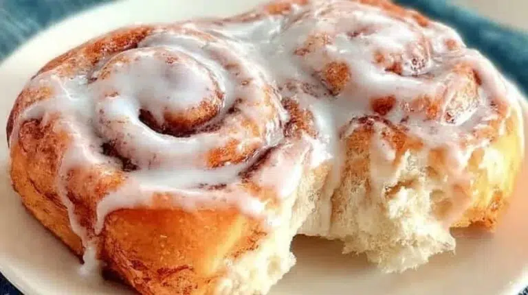 Easy one hour cinnamon rolls topped with creamy frosting