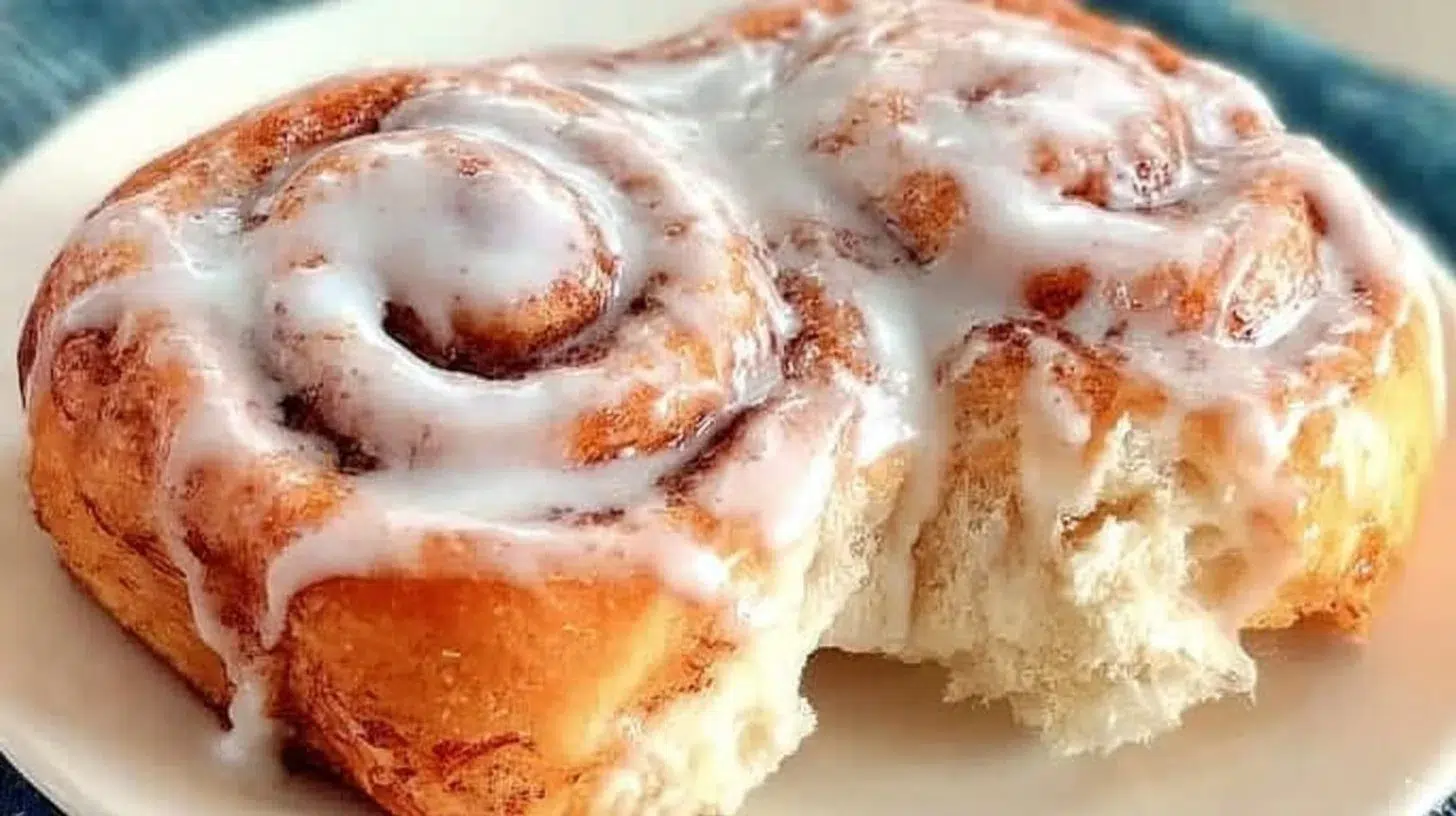 Easy one hour cinnamon rolls topped with creamy frosting
