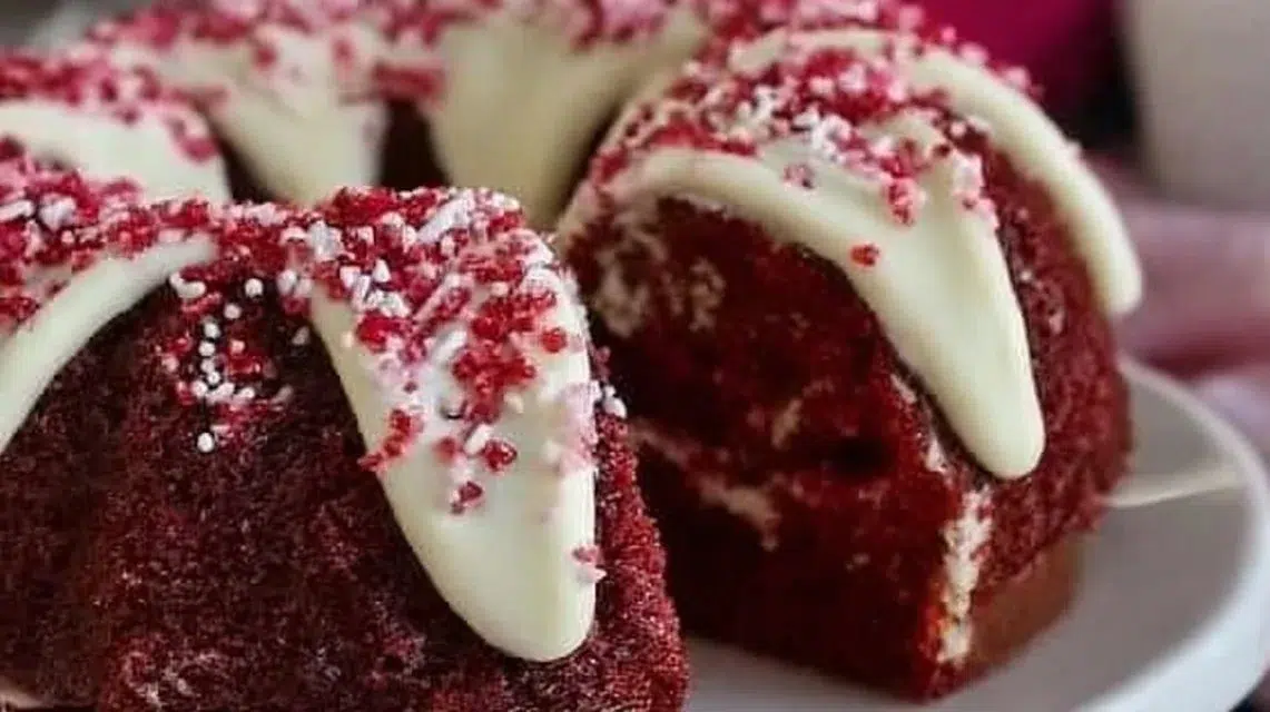 Delicious Red Velvet Cake with cream cheese frosting and decorative sprinkles