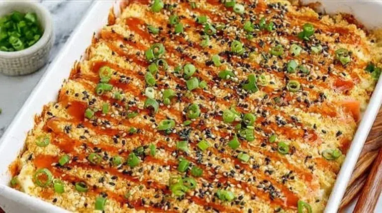 Delicious salmon sushi bake with a golden topping and fresh ingredients
