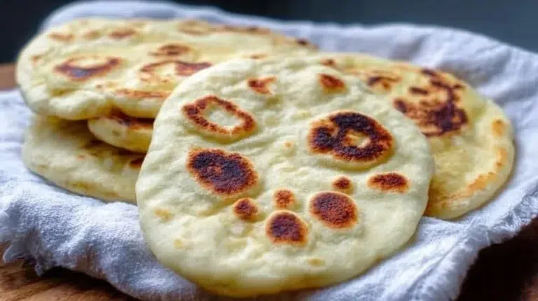 Homemade sourdough naan made from sourdough discard, perfect for unique flavor.