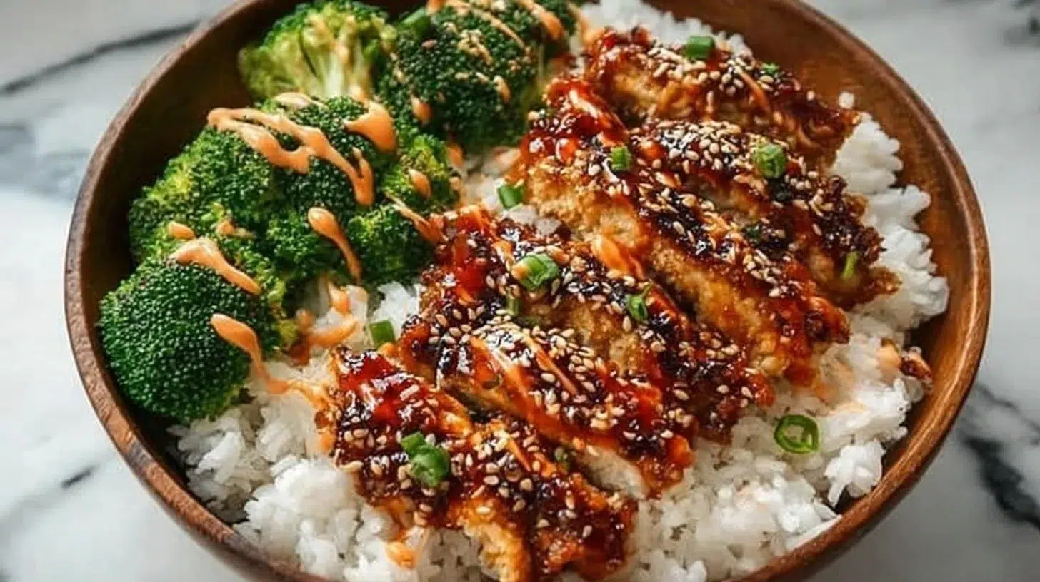 Delicious Sticky Chicken Rice Bowls with vibrant vegetables and sticky glaze.