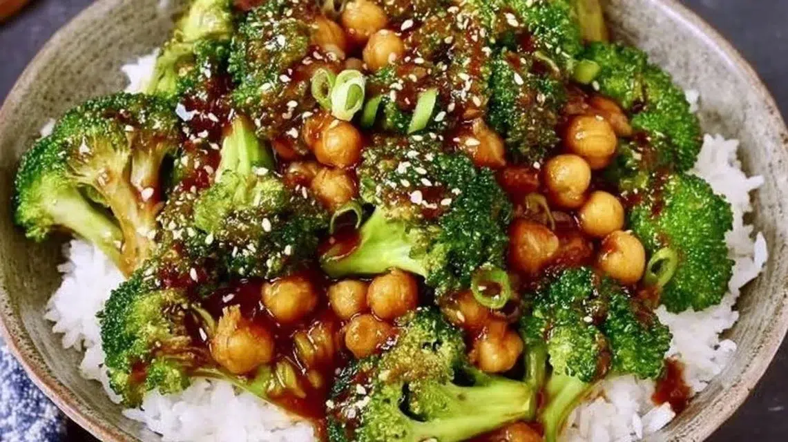 Colorful broccoli stir fry with chickpeas in a skillet.