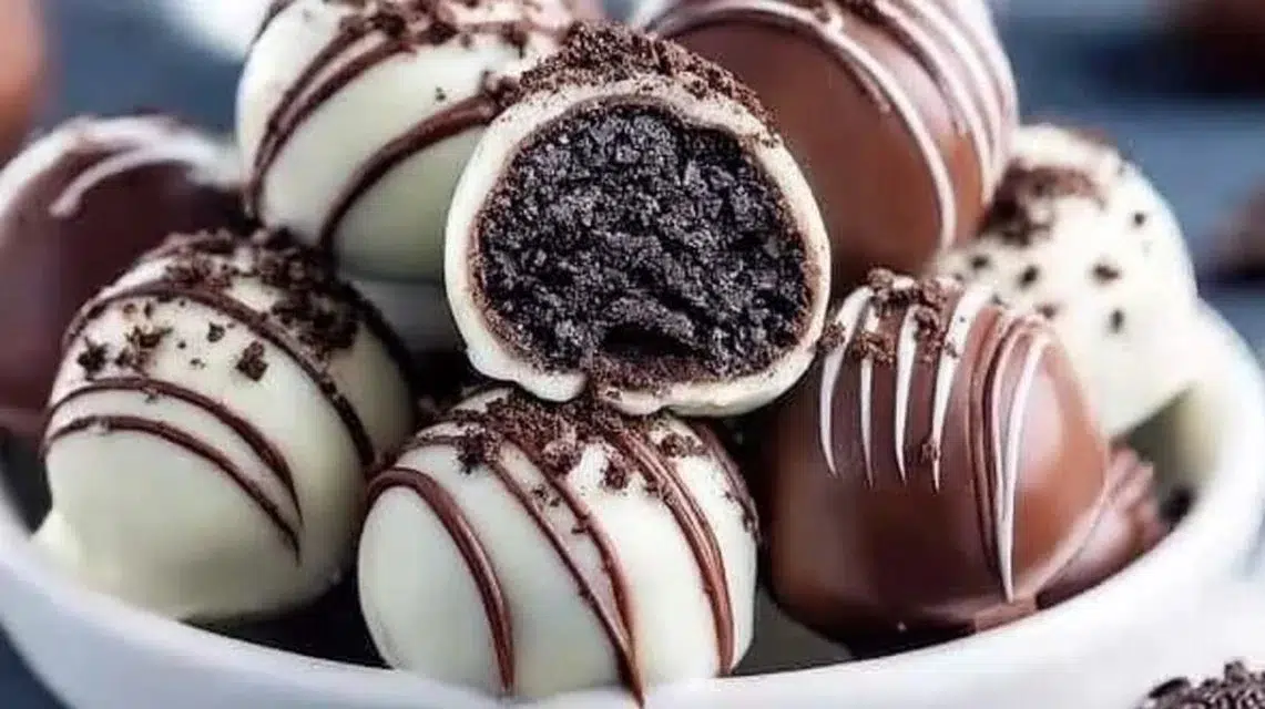 Delicious homemade Oreo Balls covered in chocolate, a perfect treat.