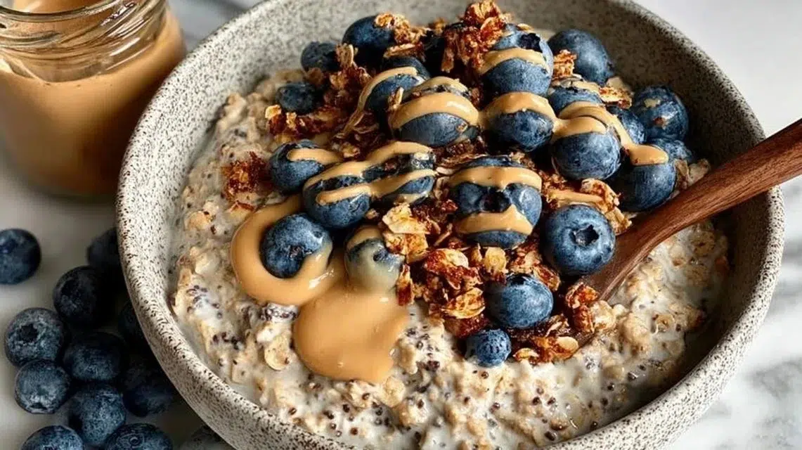 Bowl of classic overnight oats topped with fresh fruits and nuts