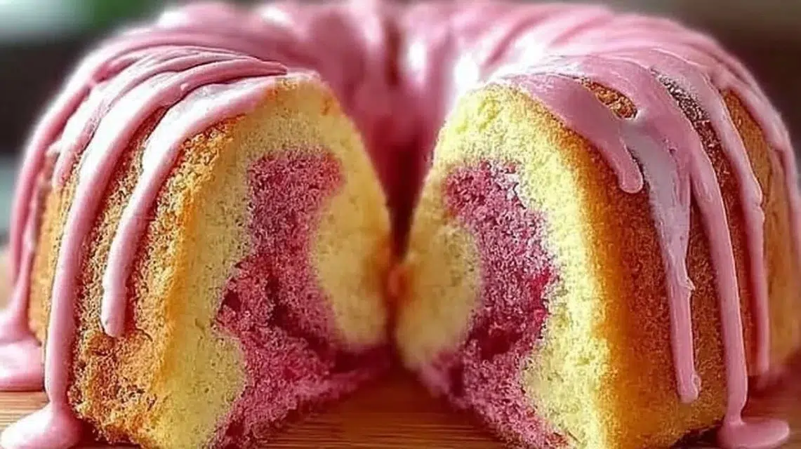 Delicious strawberry milkshake pound cake topped with fresh strawberries