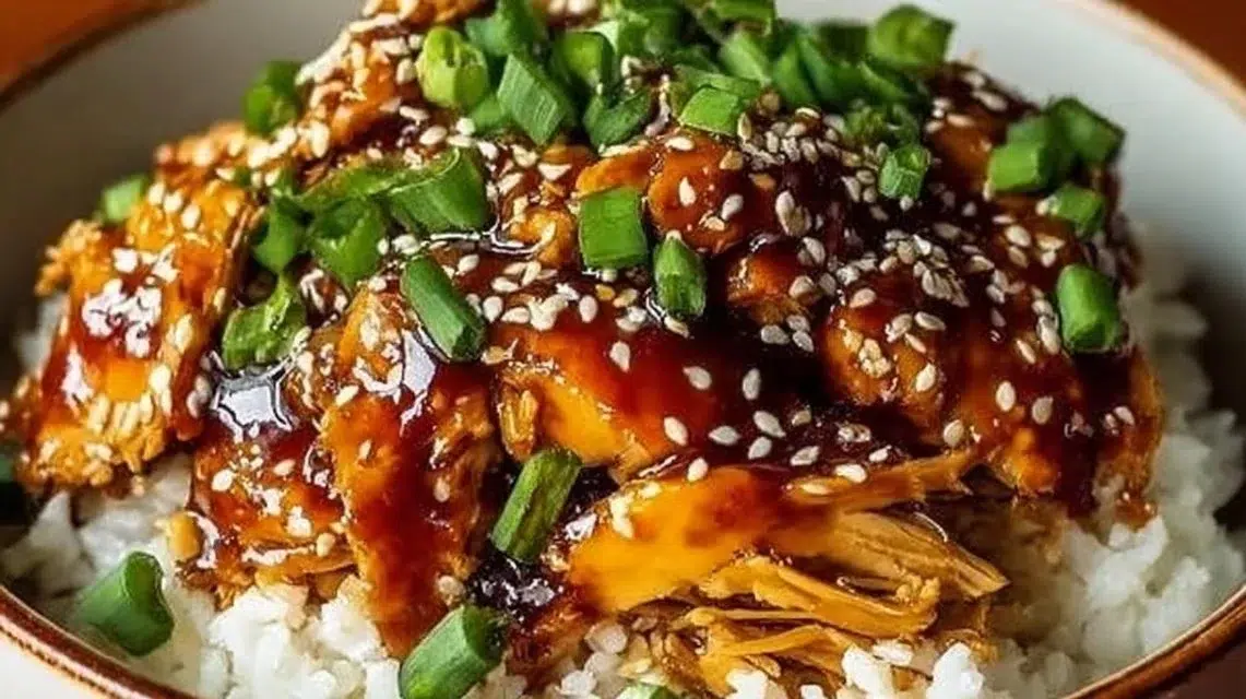 Delicious honey garlic slow cooker chicken served on a plate with garnish