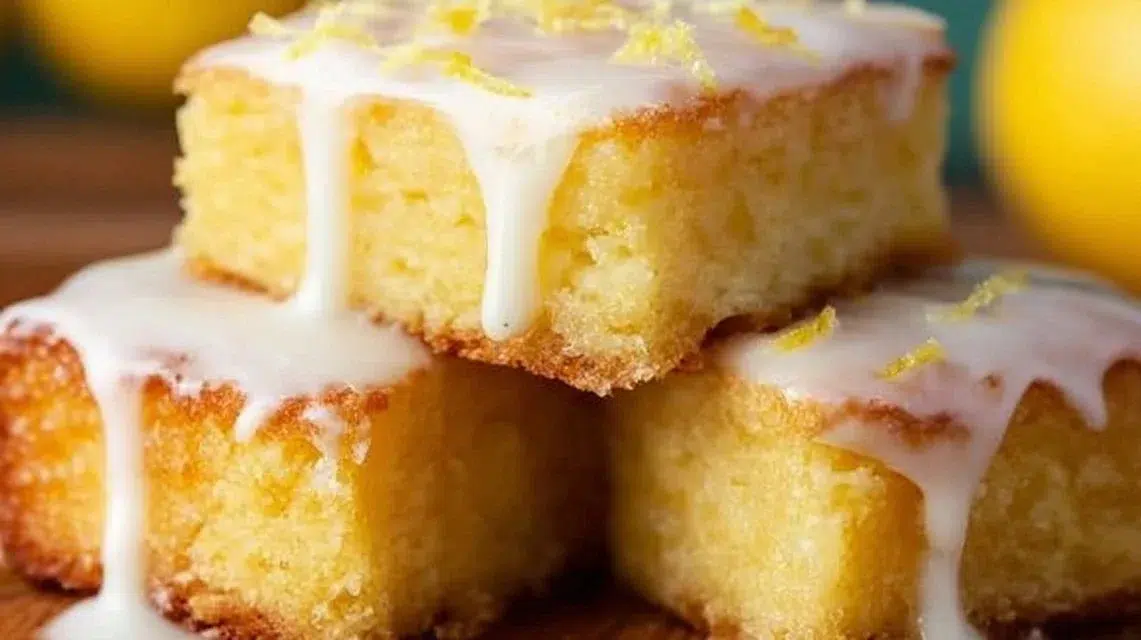 Freshly baked lemon brownies with a bright, tangy lemon glaze