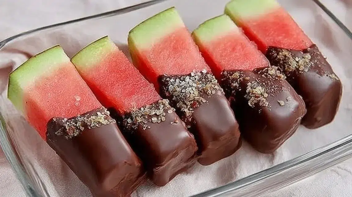 Chocolate covered watermelon slices on a plate