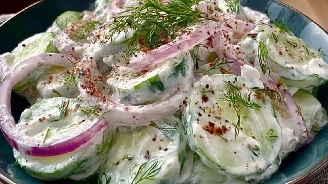 Delicious creamy cucumber salad served in a bowl