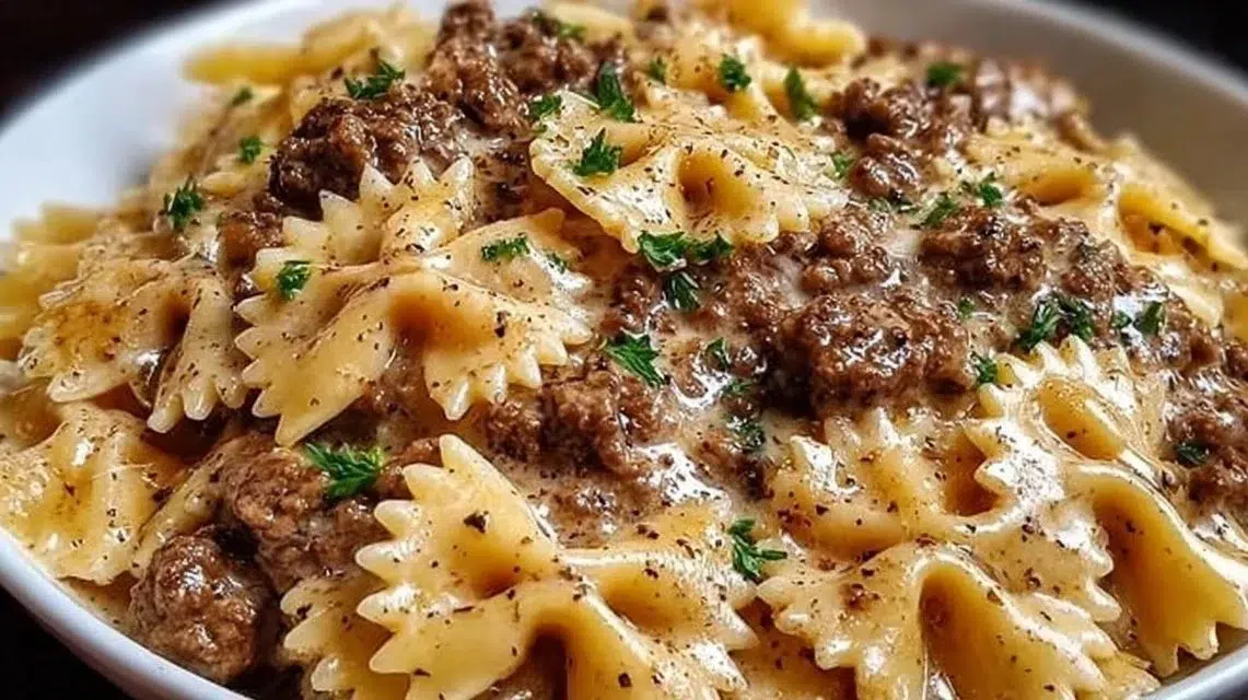 Creamy Parmesan garlic beef bowtie pasta served on a plate