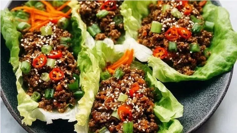 Ground beef lettuce wraps served with fresh vegetables and sauce