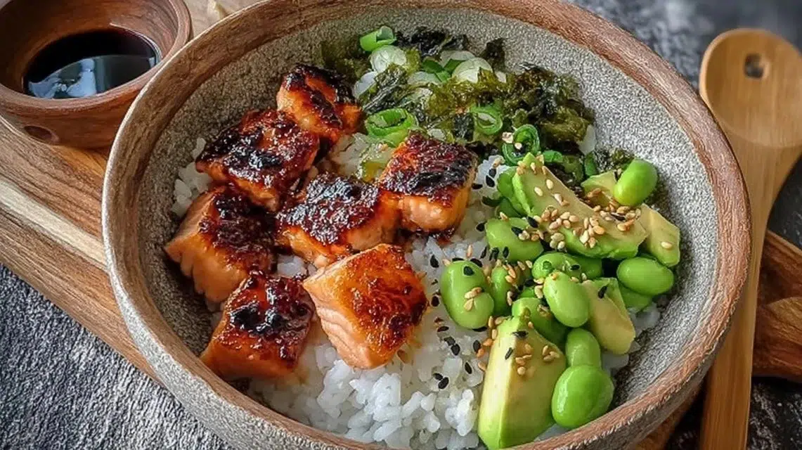 Delicious gluten-free teriyaki salmon sushi bowl garnished with vegetables and rice
