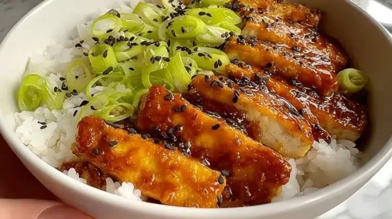 Crispy tofu with honey garlic glaze served on a plate