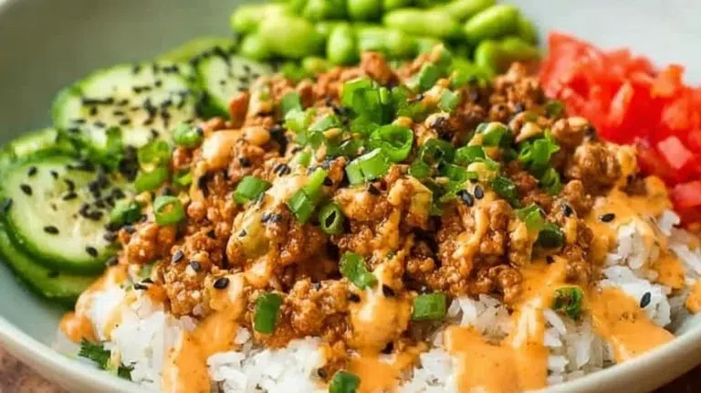 Easy ground turkey rice bowls with bang bang sauce served in a bowl